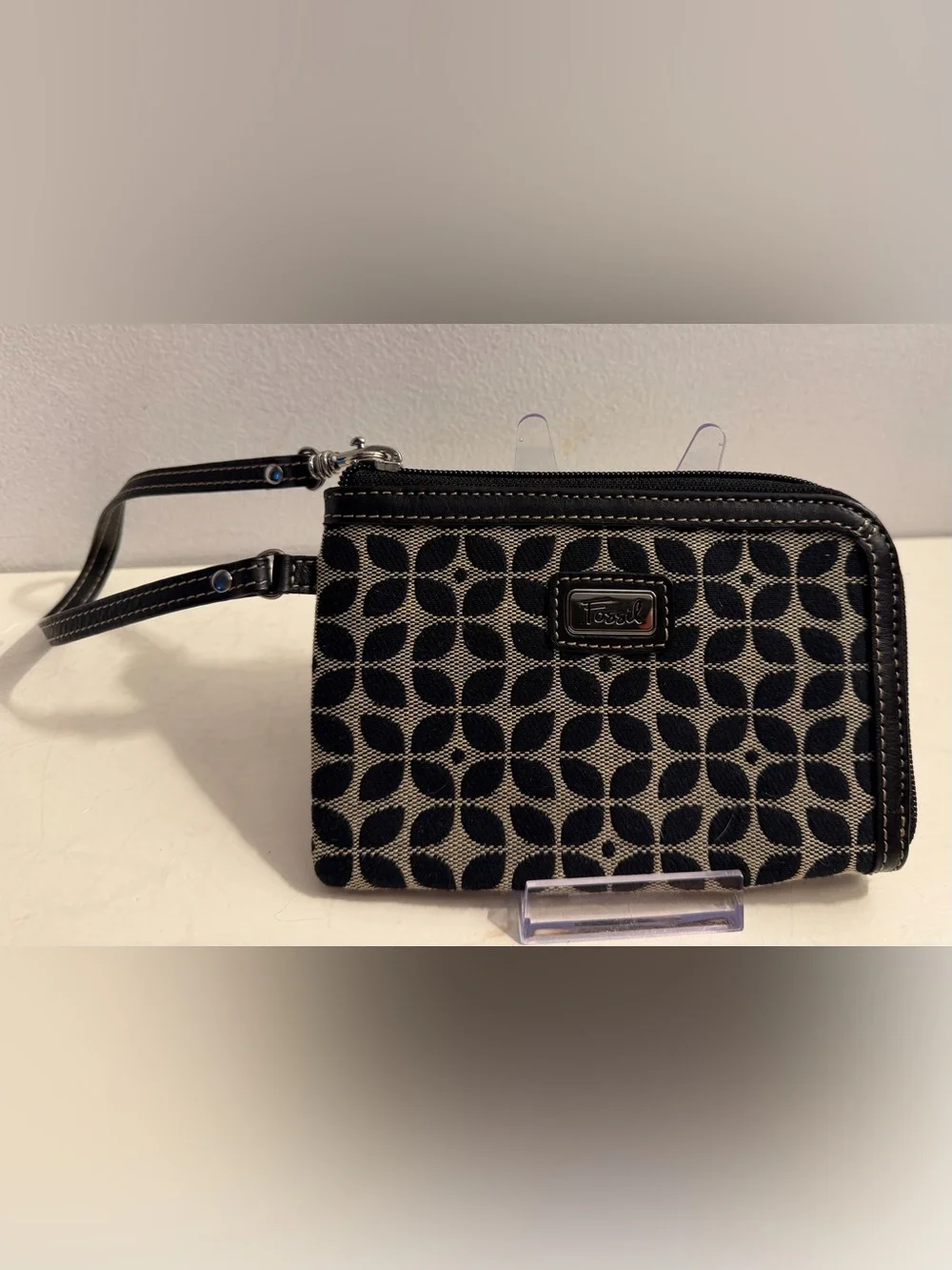 Fossil monogram canvas wristlet/wallet with leather trim.
